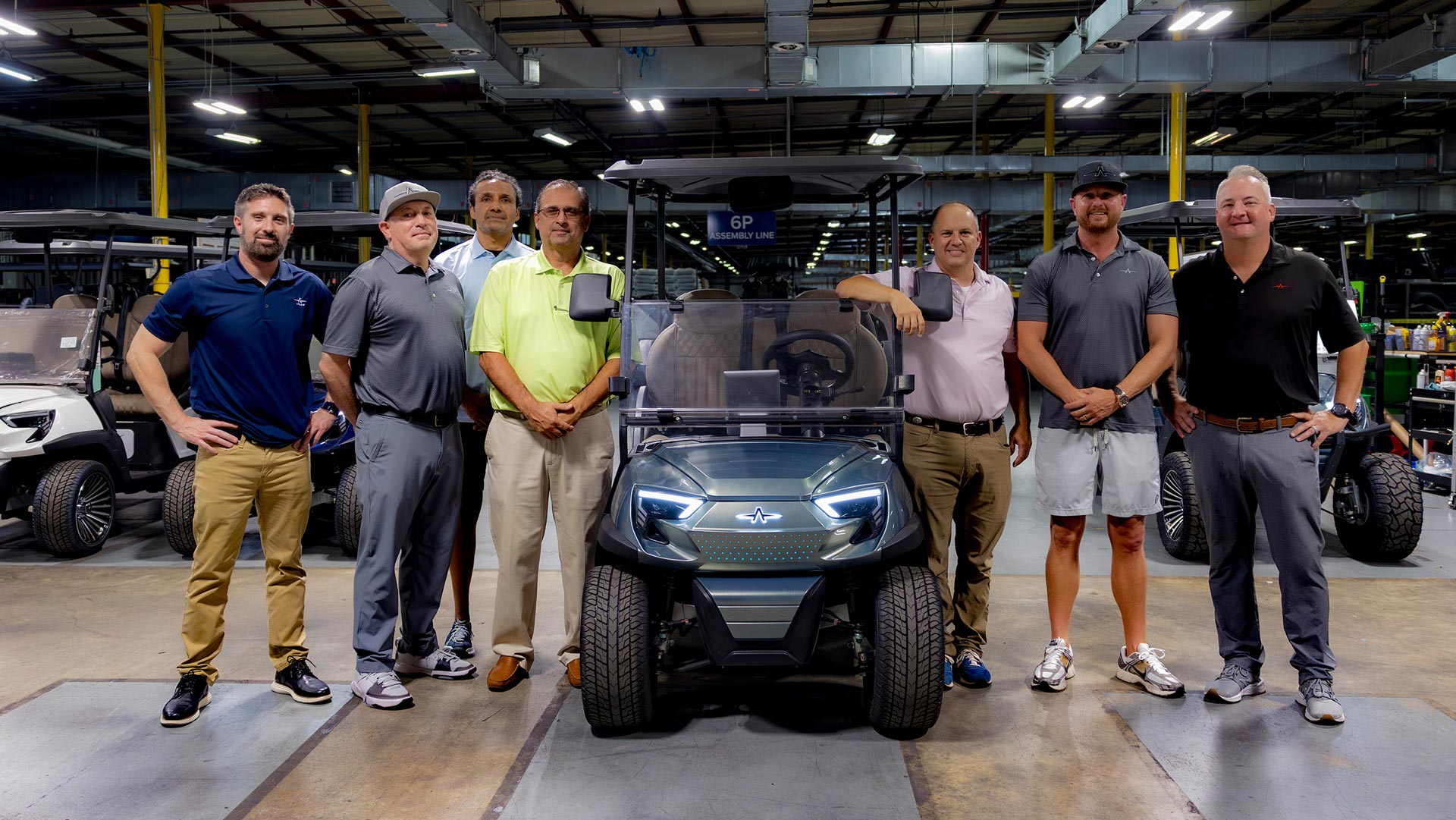 Atlas Carts executive engineering leadership team inspecting vehicle chassis